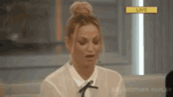 a woman is making a funny face while sitting on a couch in front of a live television screen .