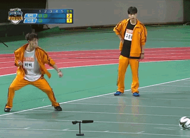 a person kicking a soccer ball in front of a scoreboard that says 1 2 3 4 5 and 6