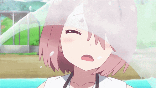 a close up of a girl 's face with a white cloth covering her face