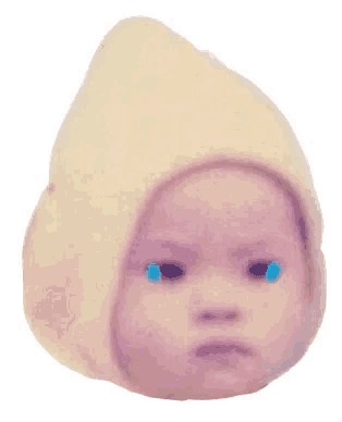 a baby wearing a white hat is crying with blue tears coming out of his eyes .