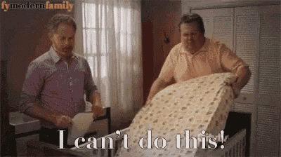 two men are standing next to a crib and one of them is saying i can 't do this !