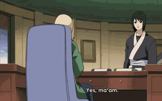 a woman sitting at a desk says yes ma'am