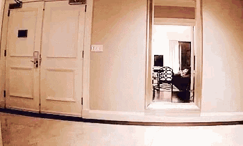 a hallway with a mirror and a door that says ' ii ' on it