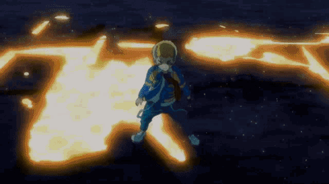 a boy in a blue jacket is standing in a circle of fire .