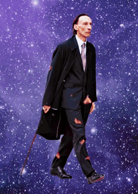 a man in a suit and tie is walking in space