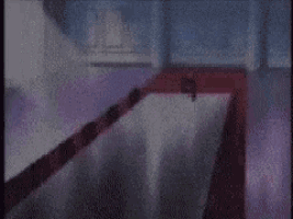 a purple room with a red carpet and a few windows