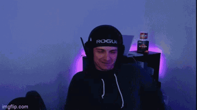 a man wearing a headband that says rogue