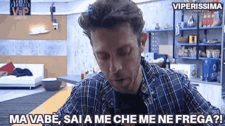 a man in a plaid shirt is saying " ma vabe "