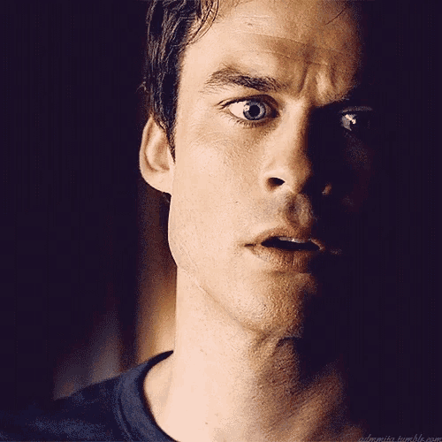 a close up of a man 's face with a dark background and a tumblr link