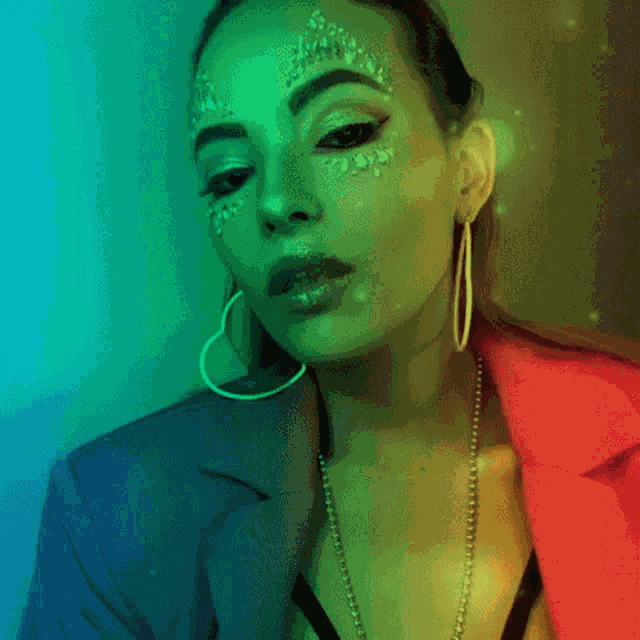 a woman with makeup on her face and earrings