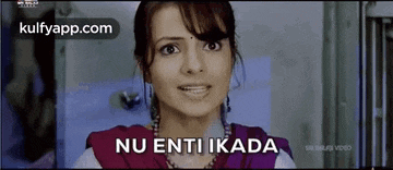 a woman is making a funny face and the words nu enti ikada are on the screen .