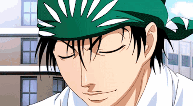 a man wearing a green headband with white lines on it