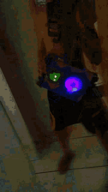a blurry picture of a person holding a purple light