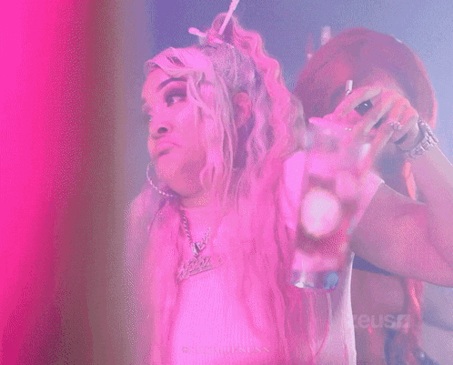 a woman smoking a cigarette in front of a pink and purple background that says ' cause ' on the bottom