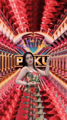 a woman in a red dress is dancing in front of a sign that says pku