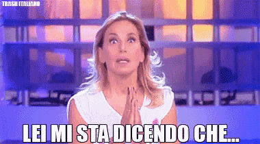 a woman with her hands folded and the words lei mi sta dicendo che on the bottom