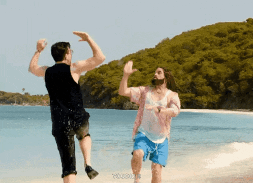 two men are dancing on a beach and the words you did it are on the bottom