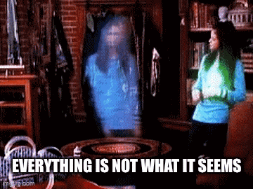 a woman is standing in front of a mirror with a ghost behind her and the words everything is not what it seems .