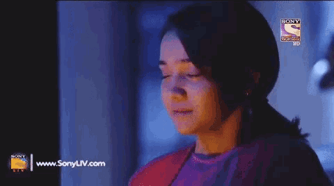 a woman 's face is shown on a sony tv screen