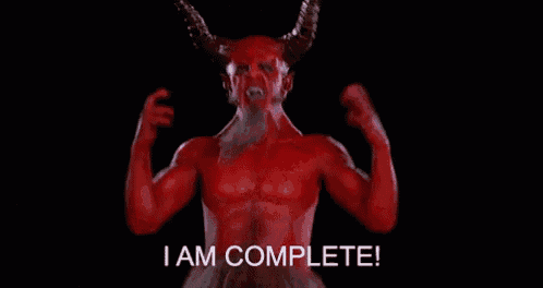 a red demon with horns and a beard says i am complete .