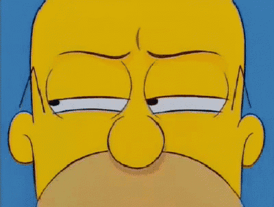 a close up of homer simpson 's face with a serious look on his face