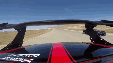 a black and red car with a sticker that says jrms on it