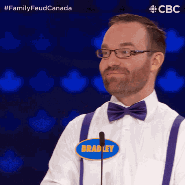 a man with suspenders and a name tag that says bradley on it