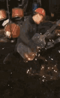 a turtle is swimming in a pool with a light shining on it