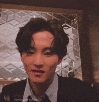 a man wearing a suit and tie says i love you scrunch