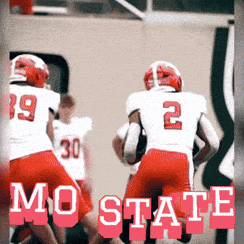 a football player with the number 2 on his back is running with the ball