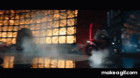 a person is standing in front of a window with smoke coming out of it and the words make a gif.com on the bottom