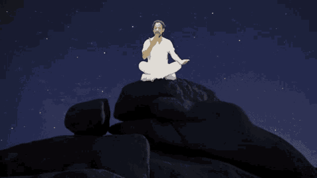a man in a white shirt sits in a lotus position on top of a large rock