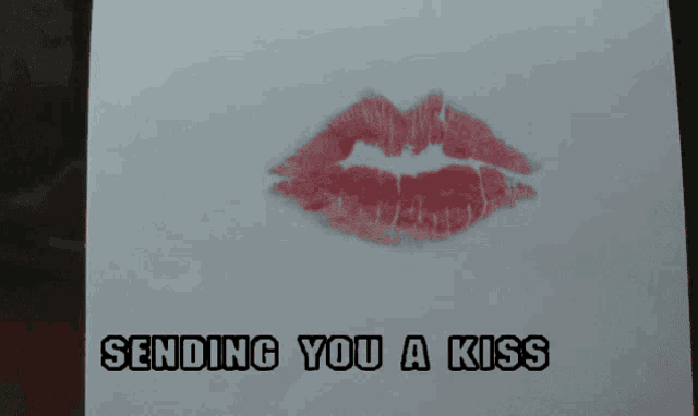 a card that says sending you a kiss with a picture of a kiss