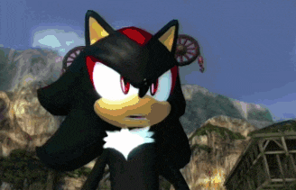 shadow the hedgehog stands in front of a mountain in a video game
