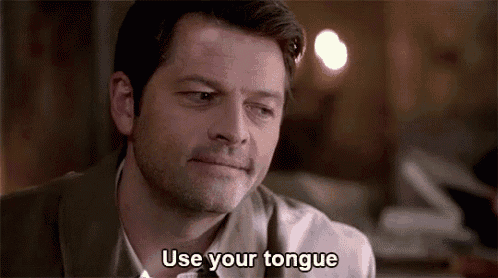 a man is saying `` use your tongue '' while looking down .