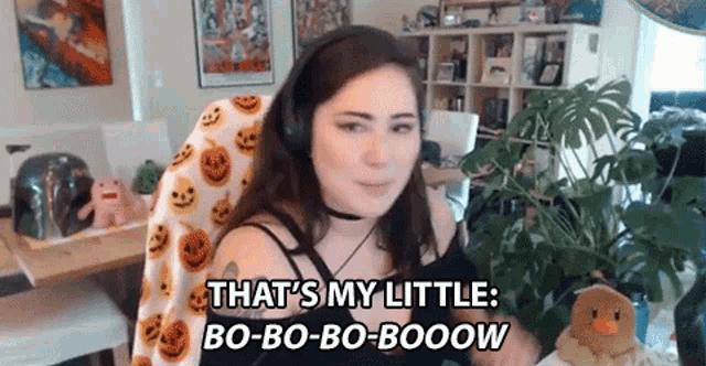 a woman wearing headphones says that 's my little bo-bo-bo-booow