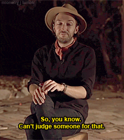 a man in a cowboy hat is kneeling down and saying so you know can 't judge someone for that