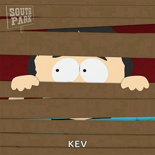 a cartoon character from south park is peeking through a wooden fence