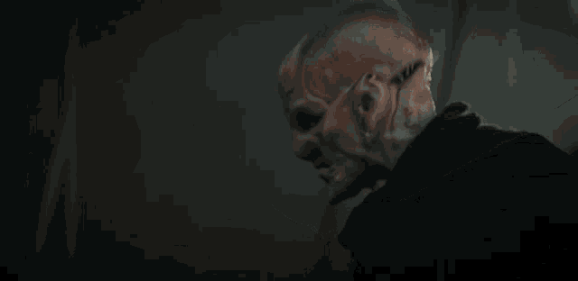 a close up of a person 's face with a mask on .