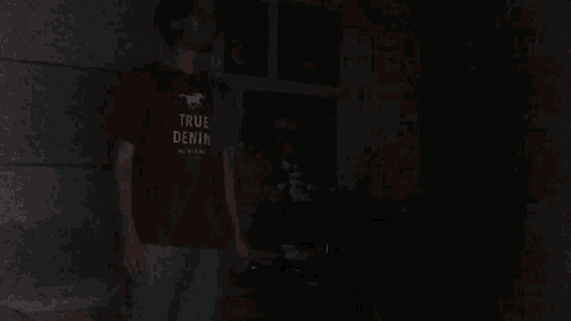 a blurry picture of a person 's arm in a red shirt