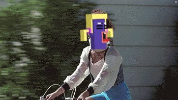 a woman is riding a bike with a pixelated face