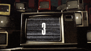 a stack of old televisions with the number 3 displayed on the screen