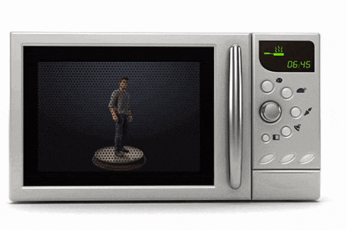 a silver microwave with a green display that says 06:45