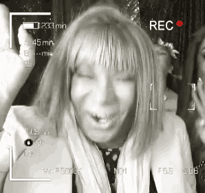 a black and white photo of a woman with a rec button