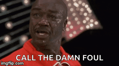 a man in a red shirt is crying with the words call the damn foul written below him .