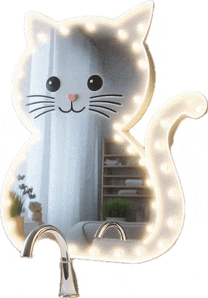 a cat shaped mirror with lights behind it
