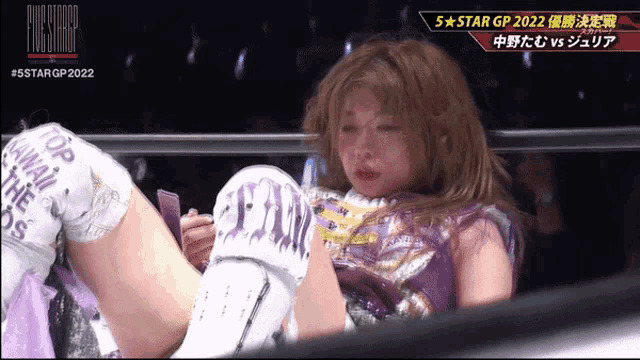 a woman in a wrestling ring with the words 5 star gp 2022