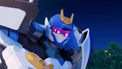 a blue and white robot with purple glasses and a gold horn