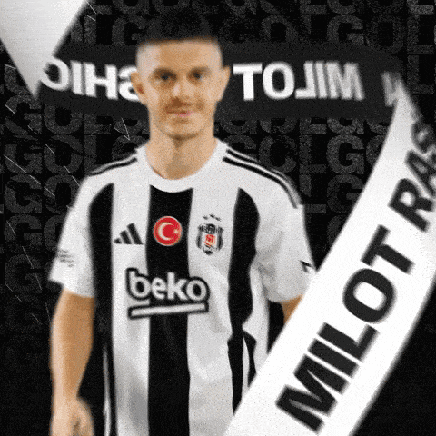 a man wearing a beko jersey is holding a banner that says milot ras