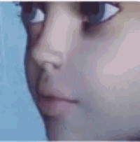 a close up of a person 's face with their mouth open .